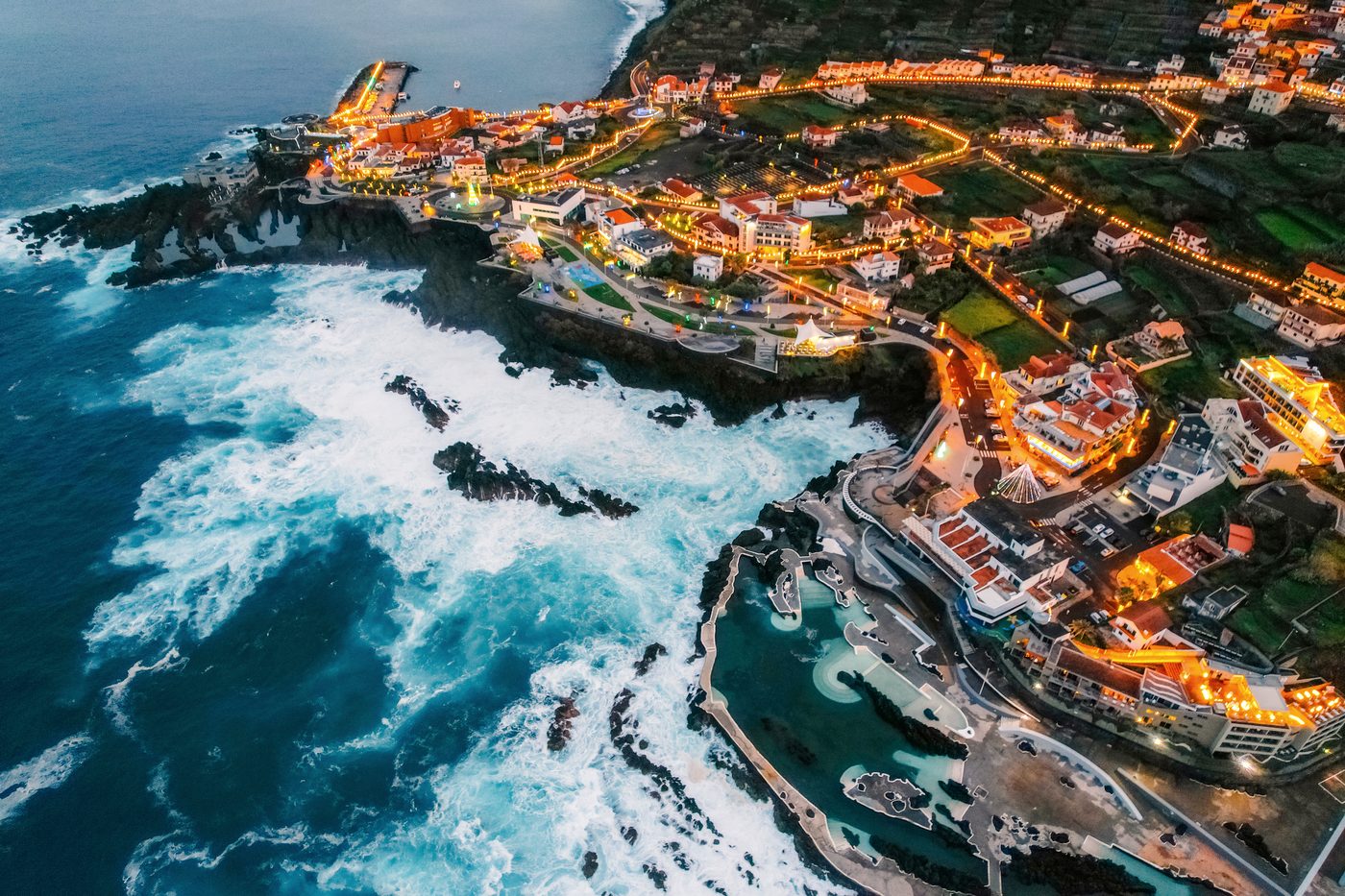 Porto Moniz at dusk, lights along the north coast of Madeira